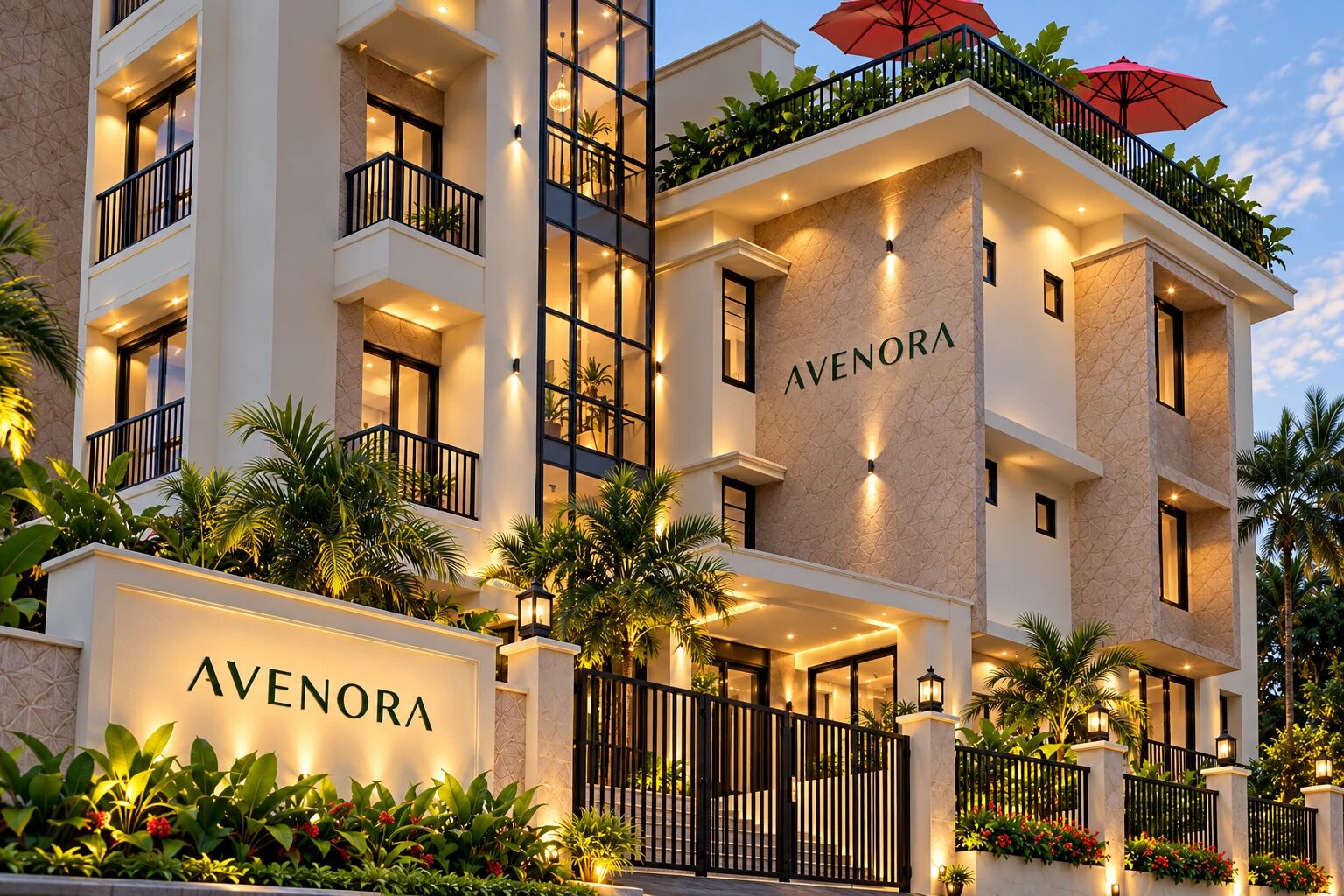 The Avenora entrance at dusk: signage wall, gated entry and the lit facade with rooftop terrace